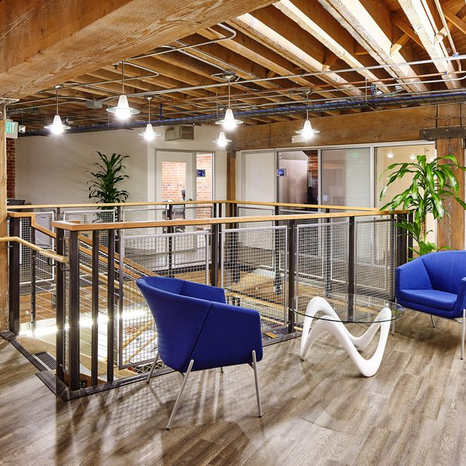exposed timbers and brickwork in modern tech office | Rossi Builders Photos